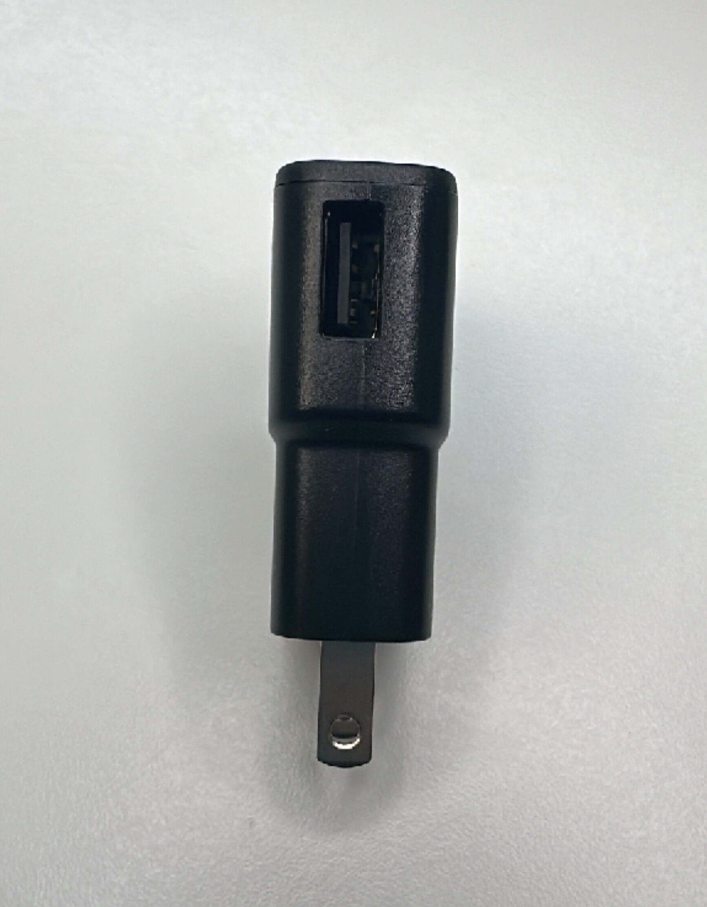 Samsung USB wall plug charger with 1AMP output, compact design, suitable for USB-A devices, black color.